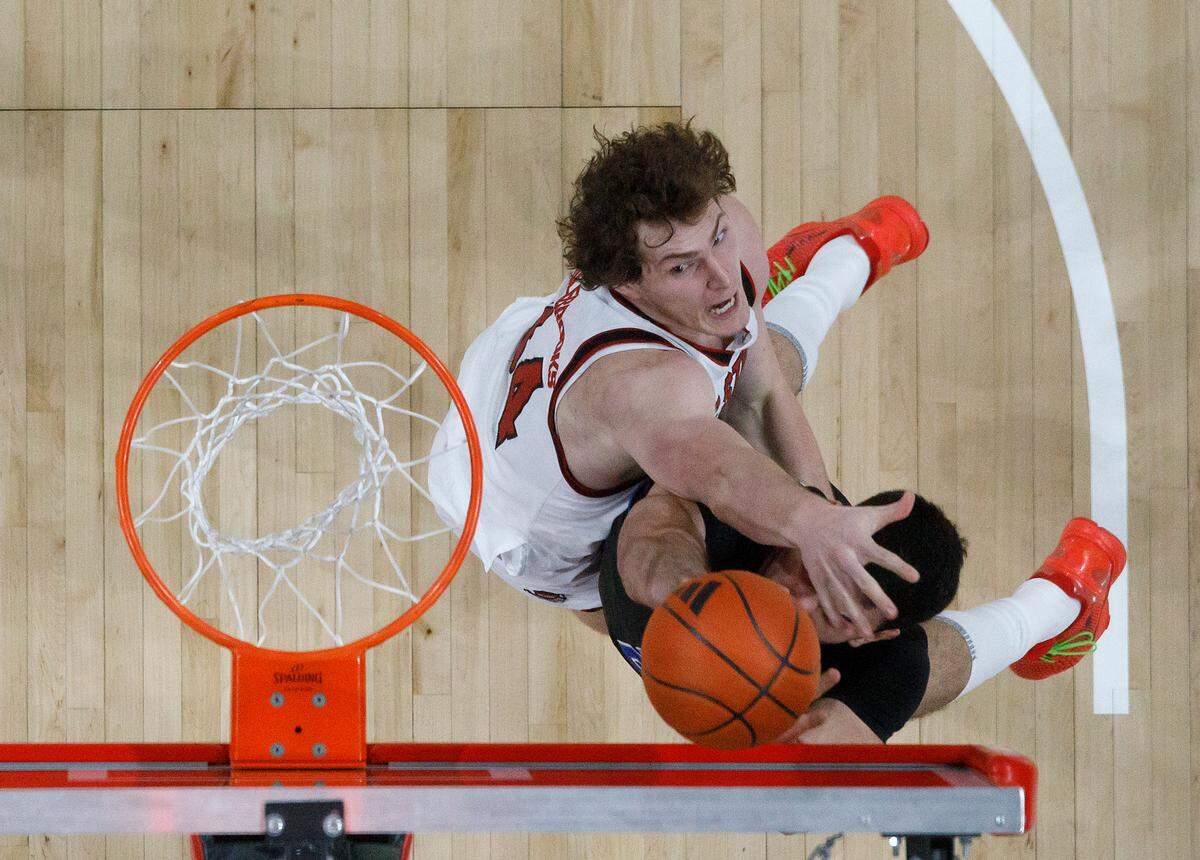N.C. State’s Ben Middlebrooks contests a shot by Southern Methodist’s Samet Yigitoglu during the second half of the Wolfpack’s 63-57 loss on Saturday, Jan. 25, 2025, at Lenovo Center in Raleigh, N.C.