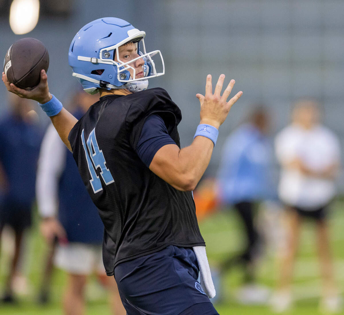 North Carolina graduate transfer quarterback Max Johnson (14) looks for an open receiver during the Tar Heels’ first practice of the season on Monday, July 29, 2024 in Chapel Hill, N.C.
