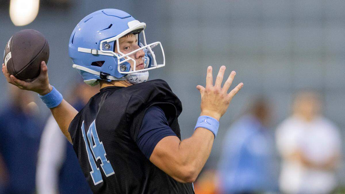 North Carolina graduate transfer quarterback Max Johnson (14) looks for an open receiver during the Tar Heels’ first practice of the season on Monday, July 29, 2024 in Chapel Hill, N.C.