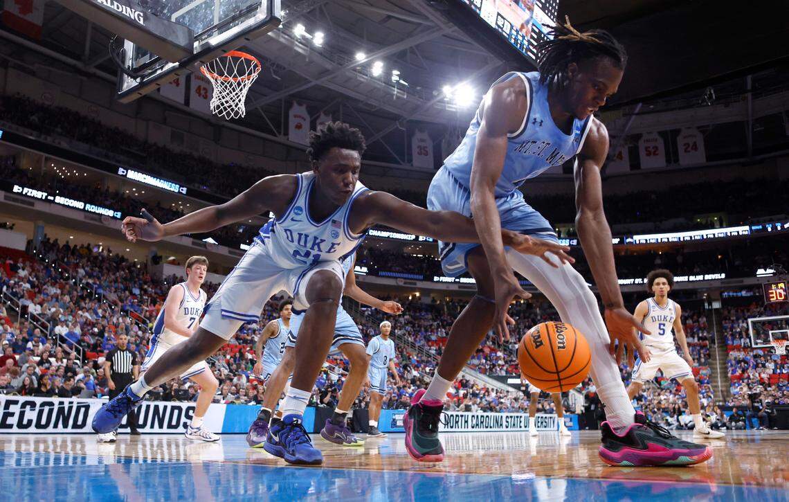 Duke’s Patrick Ngongba II (21) and Mount St. Mary’s Dola Adebayo (4) go after the ball during Duke’s 93-49 victory over Mount St. Mary’s in the first round of the 2025 NCAA Men’s Basketball Tournament at the Lenovo Center in Raleigh, N.C., Friday, March 21, 2025.