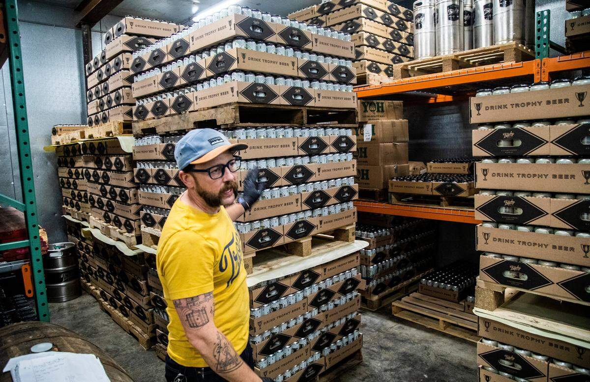 Chief Brewing Officer Les Stewart supervises operations at Trophy Brewing Company’s Maywood Avenue location in Raleigh Tuesday, May 19, 2020. The popular Raleigh brewery started kegging more beers and brewing limited small batches in anticipation of selling to more restaurants as coronavirus restrictions are lifted. Under Phase 2 of North Carolina’s reopening plan, bars will remain closed. The NC Craft Brewers Guild argues a brewery is not a bar, but seeks clarification from the state.