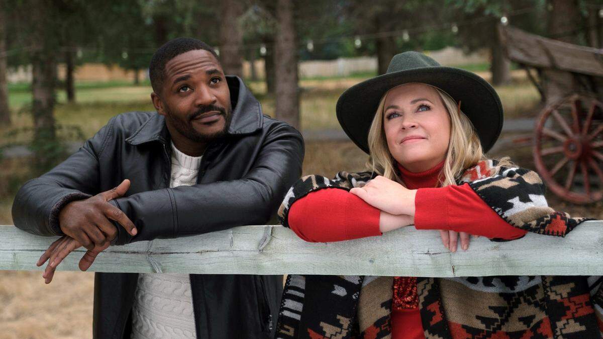 Duane Henry and Melissa Joan Hart in the Lifetime Christmas movie “Mistletoe in Montana.”