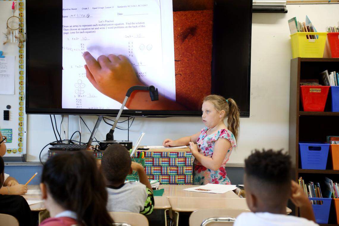 Third grader Melina King demonstrates how she solved a math problem in front of her class at Fox Road Elementary School in North Raleigh on Wednesday, Sept. 11, 2019. The school doubled its passing rate on state exams over the last seven years and its students are exceeding growth expectations on tests.