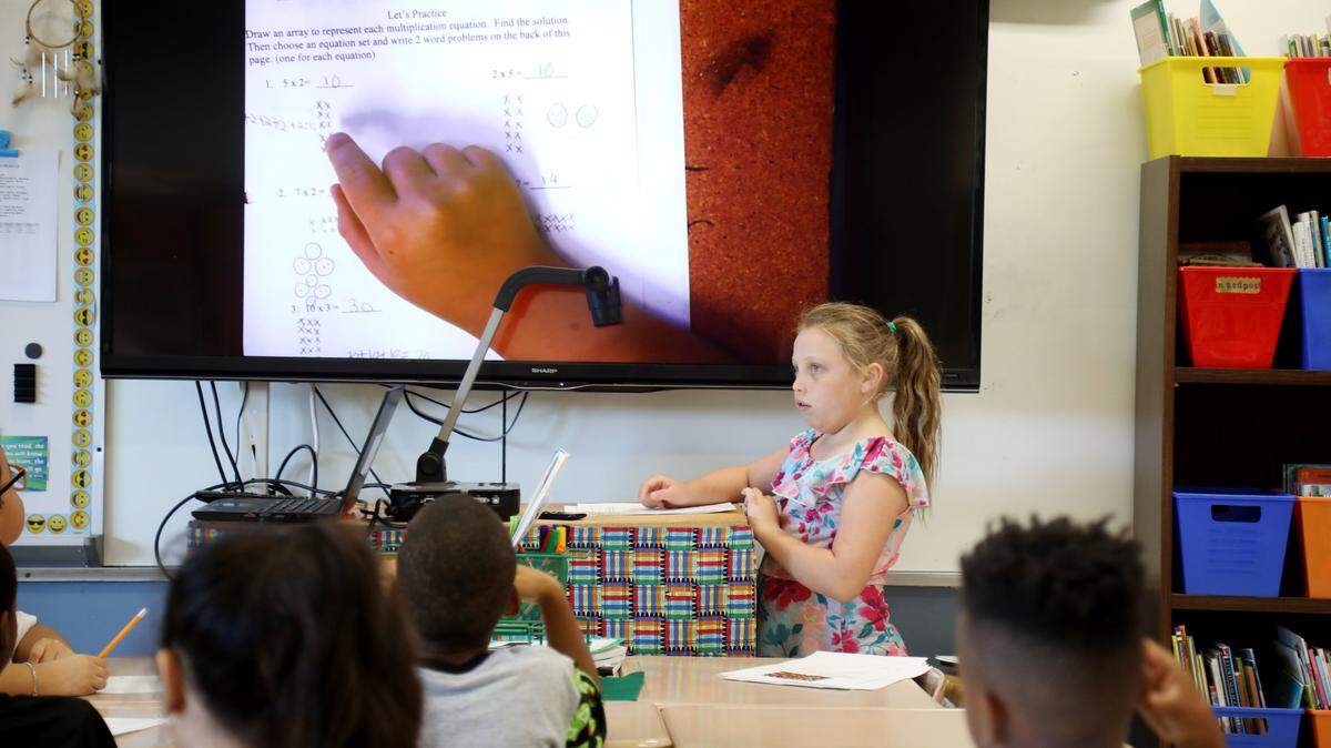 Third grader Melina King demonstrates how she solved a math problem in front of her class at Fox Road Elementary School in North Raleigh on Wednesday, Sept. 11, 2019. North Carolina is redesigning its K-12 math standards.