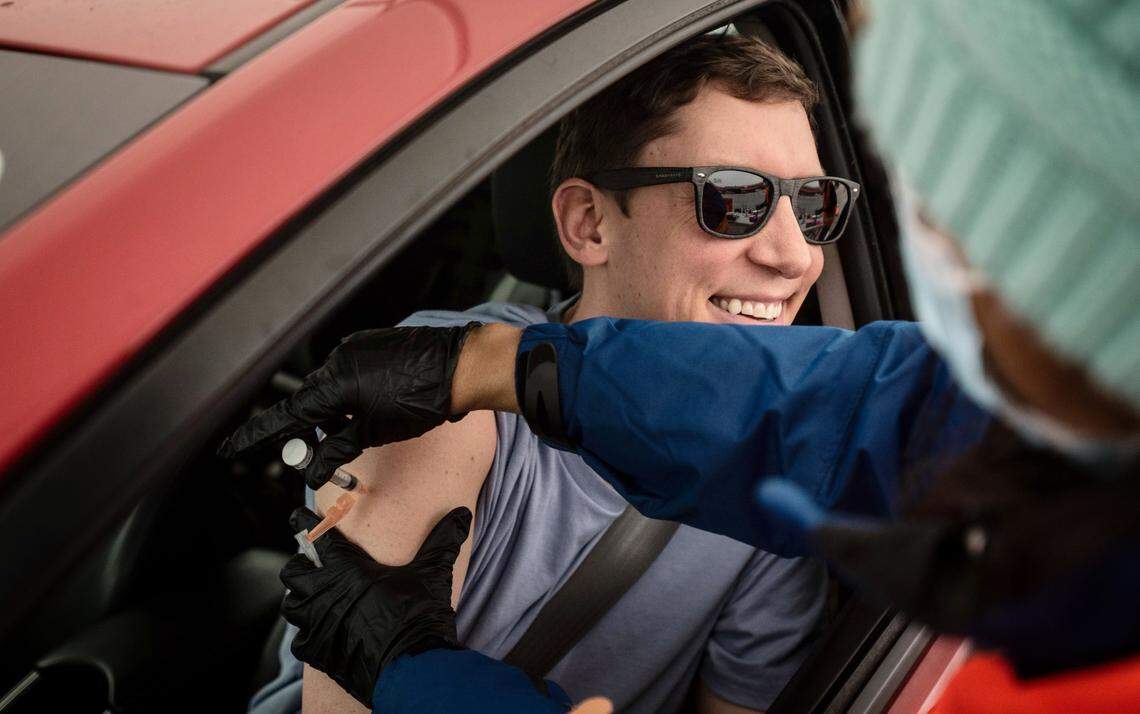 Ann Mathew (right) administers a COVID-19 vaccine to Troy Carlton in Salisbury, N.C. on Wednesday, March 17, 2021.