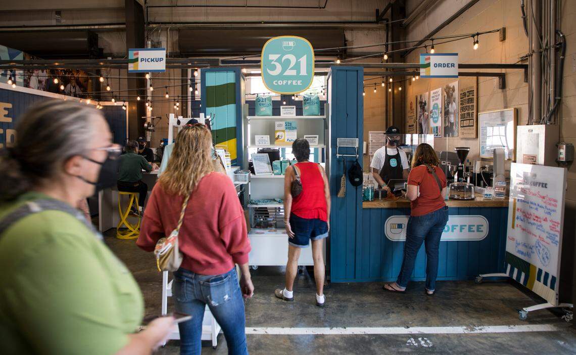 Customers line up to order drinks at 321 Coffee, a coffee shop located at the State Farmers Market in Raleigh, N.C., on Oct. 15, 2021. The business employs adults with intellectual and developmental disabilities.