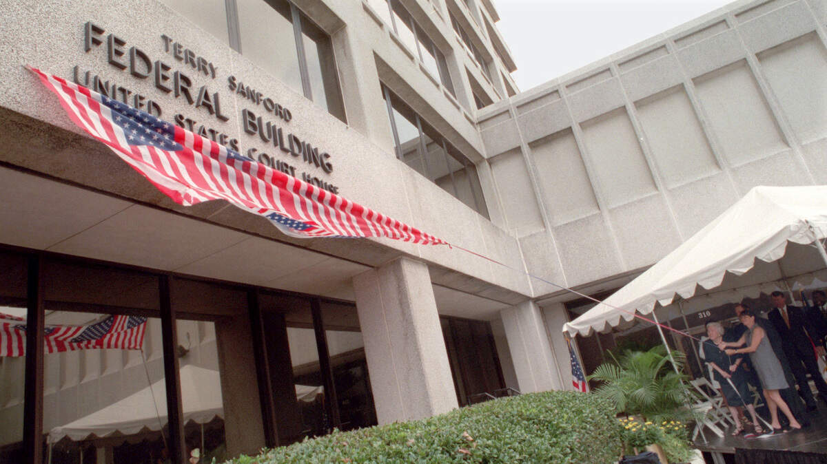 In this August 1999 file photo, the federal building in Raleigh, N.C.’s new name, the Terry Sanford Federal Building, is unveiled.