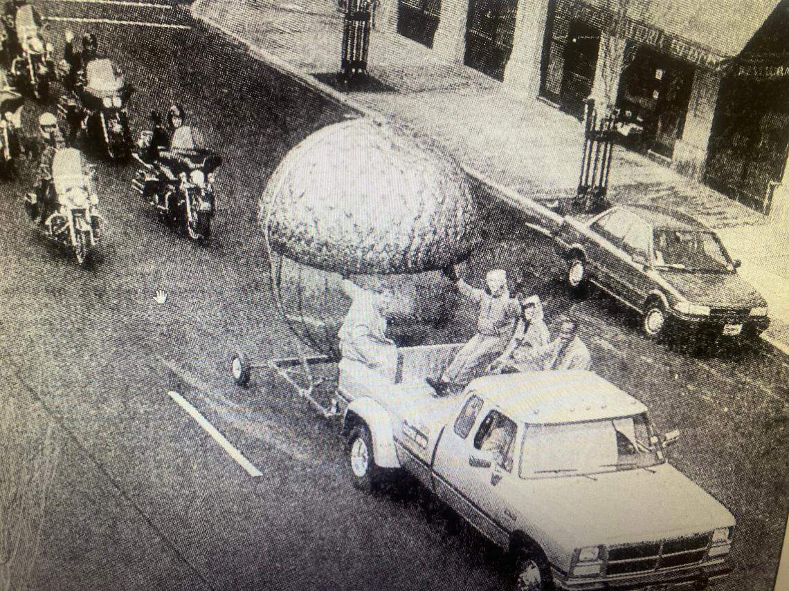 Raleigh’s acorn sculpture is carted through downtown in 1991 on its way to what was then civic center square, where it would be lowered for the first time on New Year’s Eve.