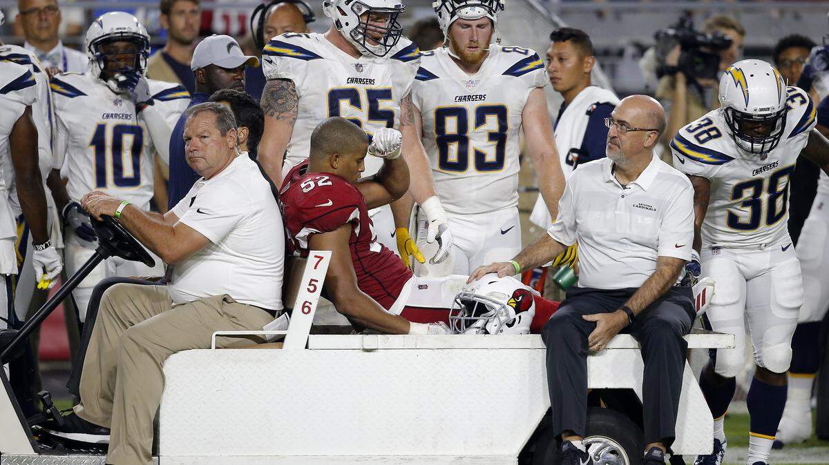 Arizona Cardinals linebacker Jeremy Cash (52) leaves the field after being injured during the second half of a preseason NFL football game against the Los Angeles Chargers, Saturday, Aug. 11, 2018, in Glendale, Ariz. (AP Photo/Ross D. Franklin)