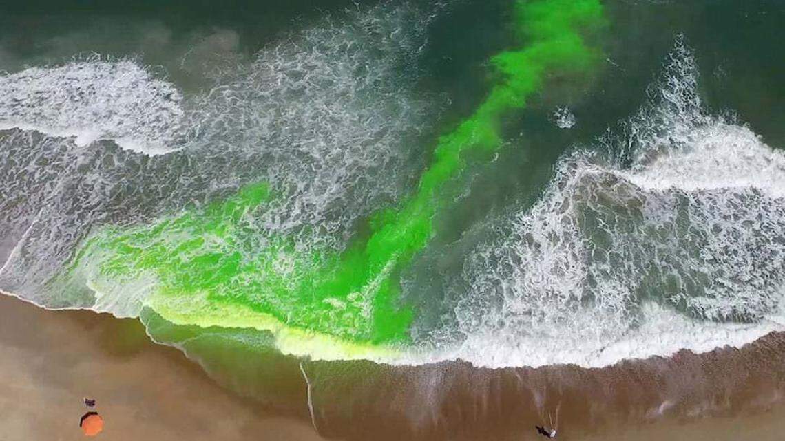 A photo from the National Oceanic and Atmospheric Administration shows a rip current in green dye. A new model from NOAA can predict the risk of rip currents days in advance.