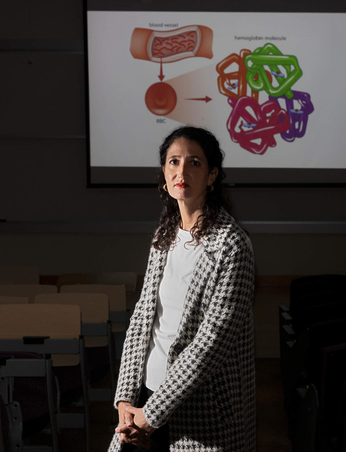 Kelly Hogan, a biology professor at Duke University, is photographed in a lecture hall on campus on Tuesday, Oct. 17, 2023, in Durham, N.C. Hogan, who taught for 18 years at UNC-Chapel Hill, will begin teaching at Duke next semester.