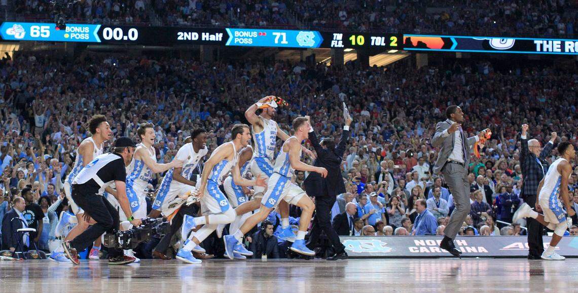 The North Carolina bench rushes the court after UNC’s victory over Gonzaga in the NCAA Division I men’s basketball national championship game at the University of Phoenix Stadium in Glendale, AZ, Monday, April 3, 2017.