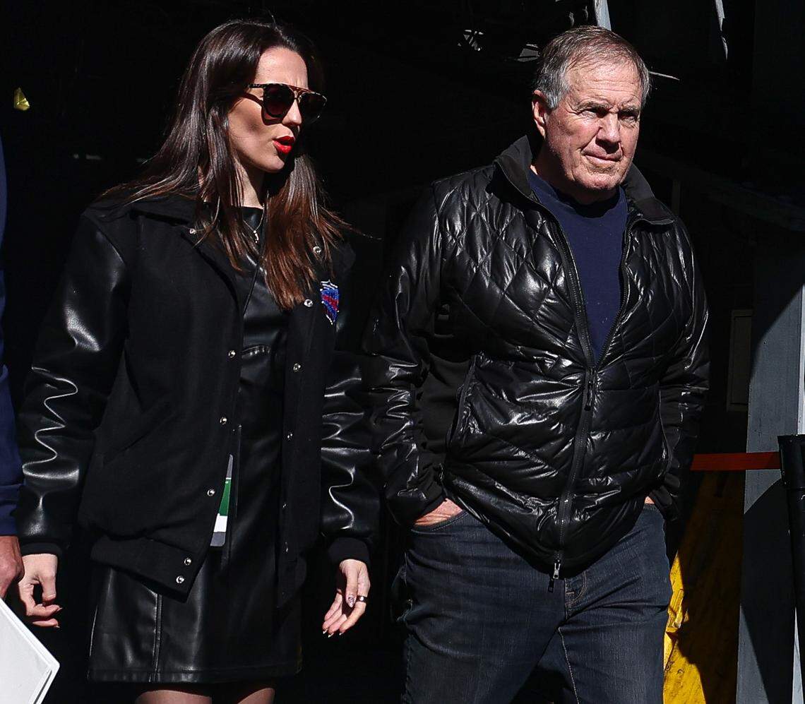 Former New England Patriots head coach Bill Belichick and girlfriend Jordon Hudson enter the field before the game between the Notre Dame Fighting Irish and the Navy Midshipmen at MetLife Stadium in Oct. 2024.