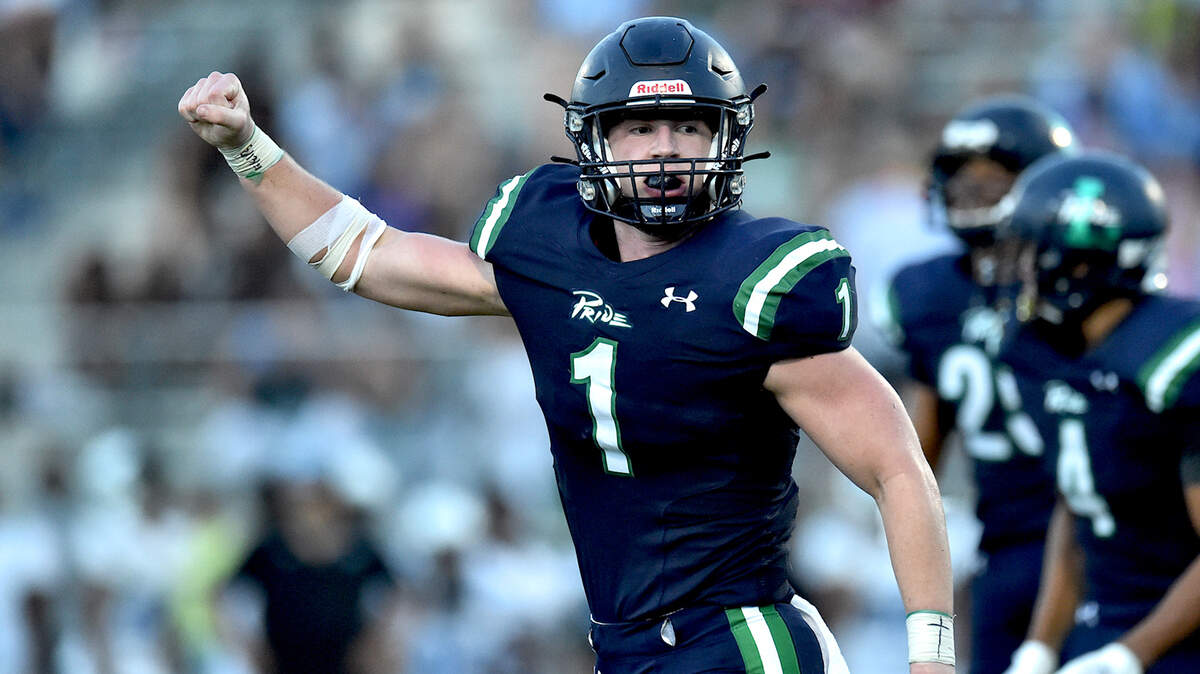 Leesville Road’s Tyler Lassiter (1) celebrates after making the interception during the first quarter. The Leesville Pride and the Panther Creek Catamounts met in a football game in Raleigh, N.C. on August 27, 2021.