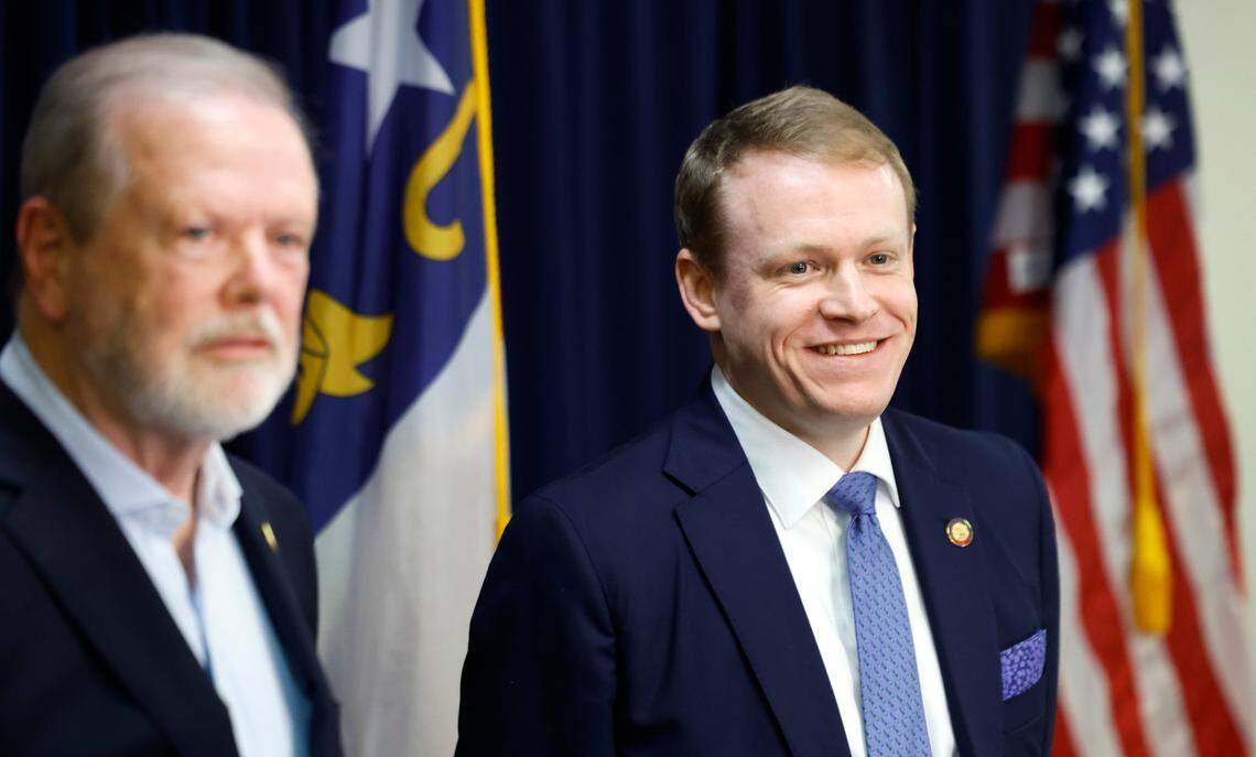 N.C. Rep. Destin Hall smiles as he listens to a question during a press conference at the N.C. Republican Party headquarters in Raleigh, N.C., Wednesday, Nov. 6, 2024. N.C. Senate leader Phil Berger stands to the left.