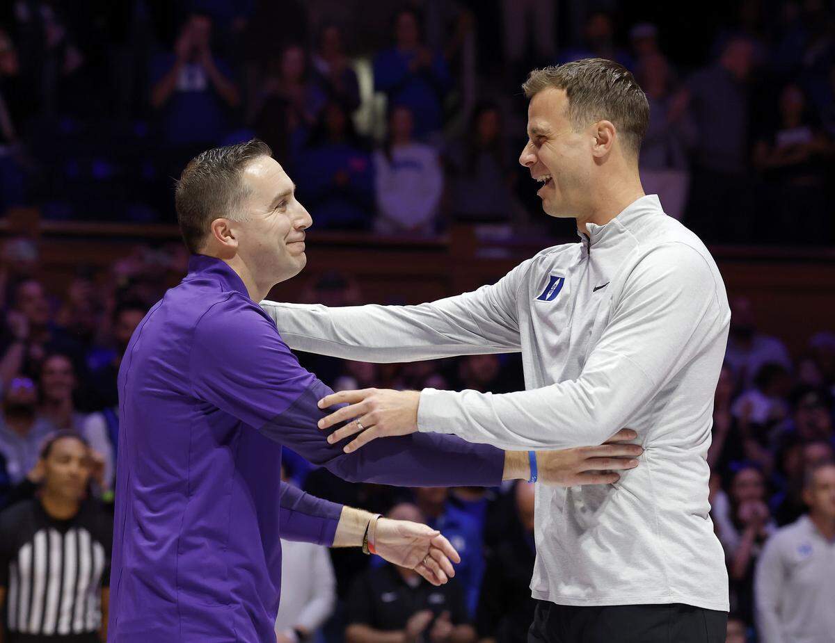 Niagara head coach Greg Paulus greets Duke head coach Jon Scheyer in a ceremony prior to the Blue Devils’ game on Friday, Nov. 21, 2025, at Cameron Indoor Stadium in Durham, N.C.