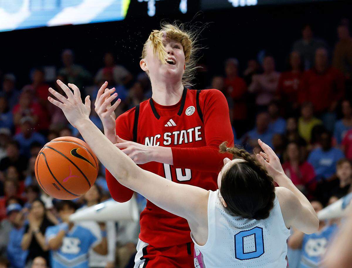 North Carolina’s Lanie Grant draws an offensive foul on N.C. State’s Tilda Trygger late in the fourth quarter of the Tar Heels’ 66-65 win on Sunday, Feb. 16, 2025, at Carmichael Arena in Chapel Hill, N.C.