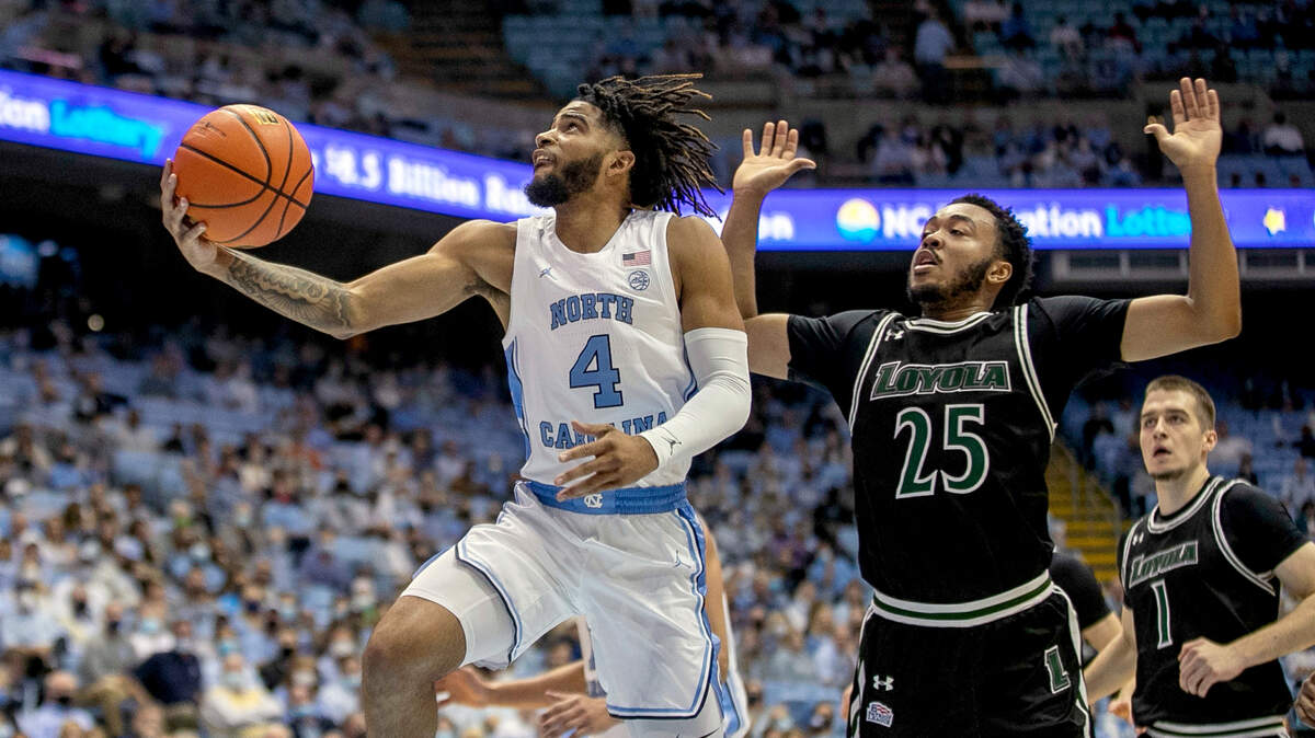North Carolina’s R.J. Davis (4) breaks to the basket on a fast break in the first half ahead of Loyola Maryland’s Kenneth Jones (25) on Tuesday, November 9, 2021 in Chapel Hill, N.C.