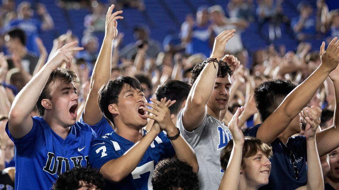 Fans in the student section cheer during the first half of the Blue Devilsí season opener against Temple at Wallace Wade Stadium on Friday, Sept. 2, 2022, in Durham, N.C.