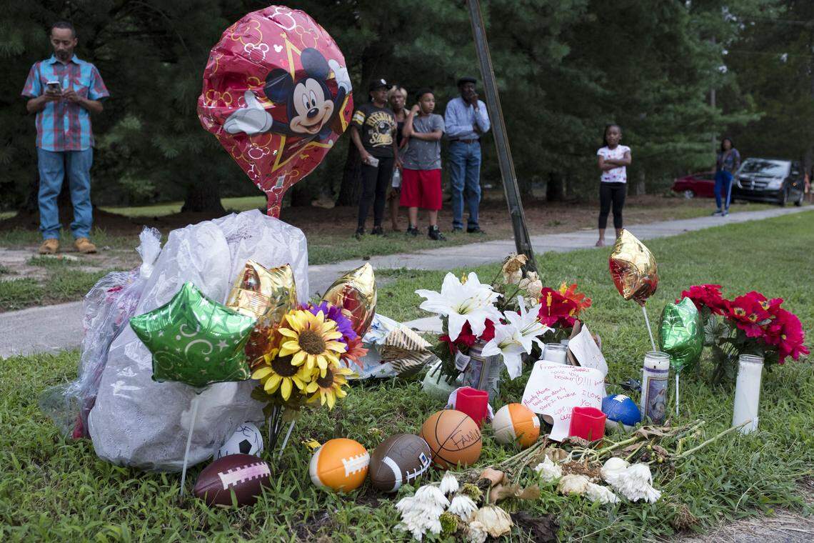 A memorial for Z’yon Person, a 9-year-old who was shot in a drive-by shooting, sits at the intersection of Leon and Duke streets in Durham in 2019.