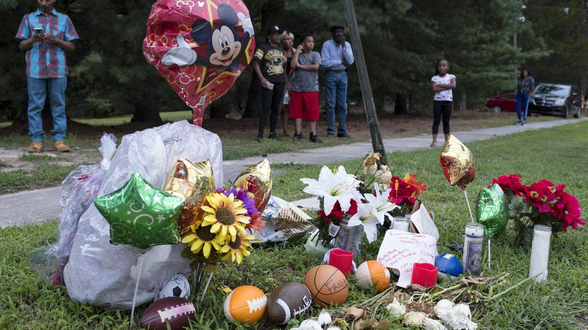 A memorial for Z’yon Person, a 9-year-old who was shot in a drive-by shooting, sits at the intersection of Leon and Duke streets in Durham in 2019.