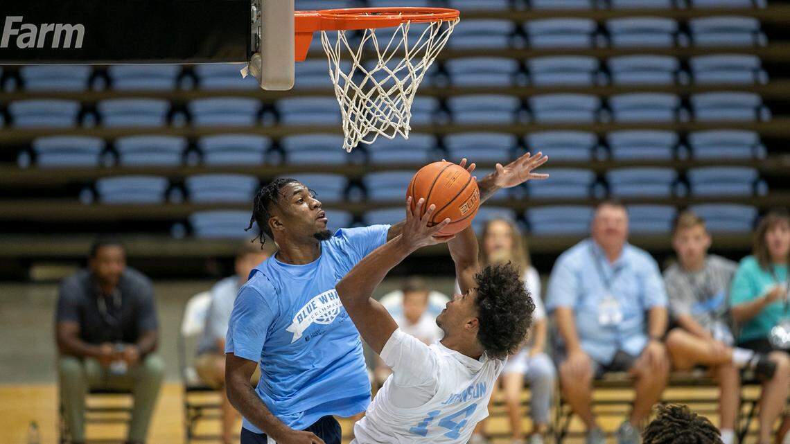 North Carolina’s Dontrez Styles (3) defends Puff Johnson (14) during their Name, Image and Likeness Blue-White game on Saturday, August 27, 2022 at the Smith Center in Chapel Hill, N.C.