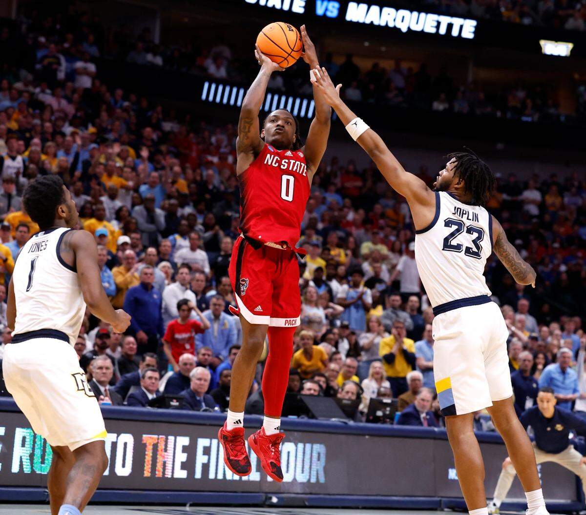 N.C. State’s DJ Horne (0) hits a three-pointer during the second half of N.C. State’s 67-58 victory over Marquette in their NCAA Tournament Sweet 16 game at the American Airlines Center in Dallas, Texas, Friday, March 29, 2024.