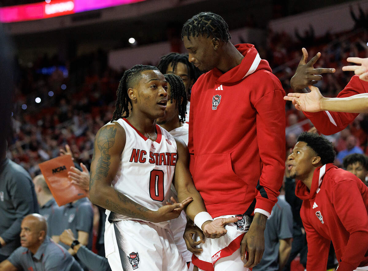 N.C. State’s DJ Horne reacts after making a three-point basket late in the Wolfpack’s 82-70 win over Saint Louis on Wednesday, Dec. 20, 2023, at PNC Arena in Raleigh, N.C.