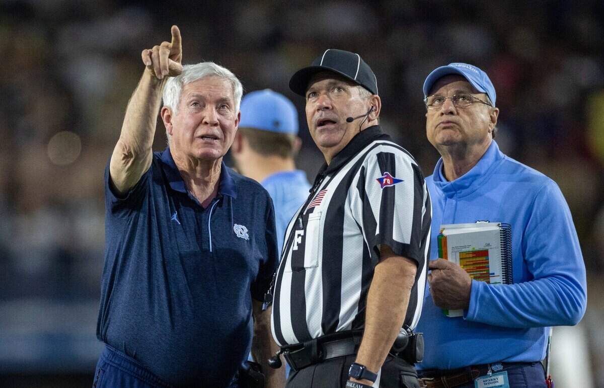 North Carolina coach Mack Brown asks field Judge Harry Tyson to watch the replay on the scoreboard after a penalty in the second quarter against Georgia Tech on Saturday, October 28, 2023 at Bobby Dodd Stadium in Atlanta, Georgia.