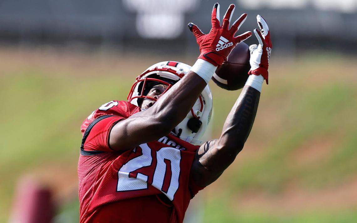 N.C. State running back Hollywood Smothers (20) pulls in a pass during the Wolfpack’s first practice in Raleigh, N.C., Wednesday, July 31, 2024.