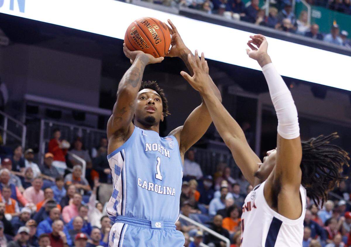 North Carolina’s Leaky Black (1) shoots as Virginia’s Armaan Franklin (4) defends during the first half of UNC’s game against Virginia in the quarterfinals of the ACC Men’s Basketball Tournament in Greensboro, N.C., Thursday, March 9, 2023.