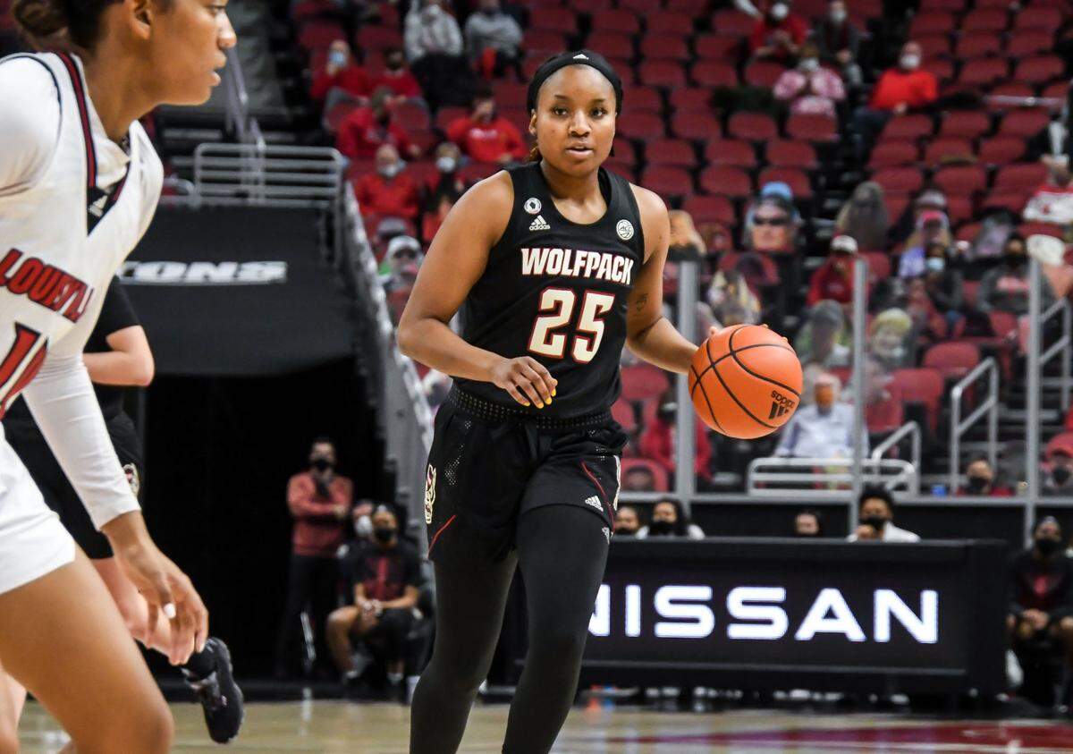 N.C. State’s Kayla Jones (25) brings the ball up court during the Wolfpack’s game against Louisville at KFC Yum! Center in Louisville, Ky. Monday, February 1, 2021.