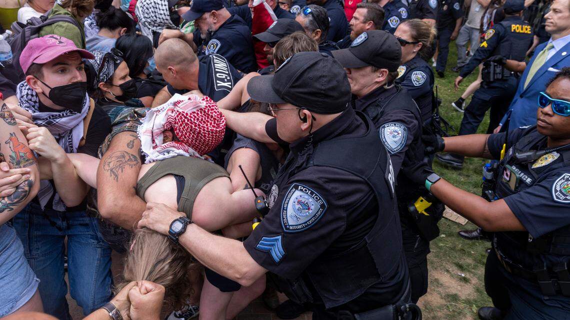 Pro-Palestinian demonstrators clash with police on April 30, 2024 after replacing an American flag with a Palestinian flag at the University of North Carolina-Chapel Hill campus in Chapel Hill, N.C.