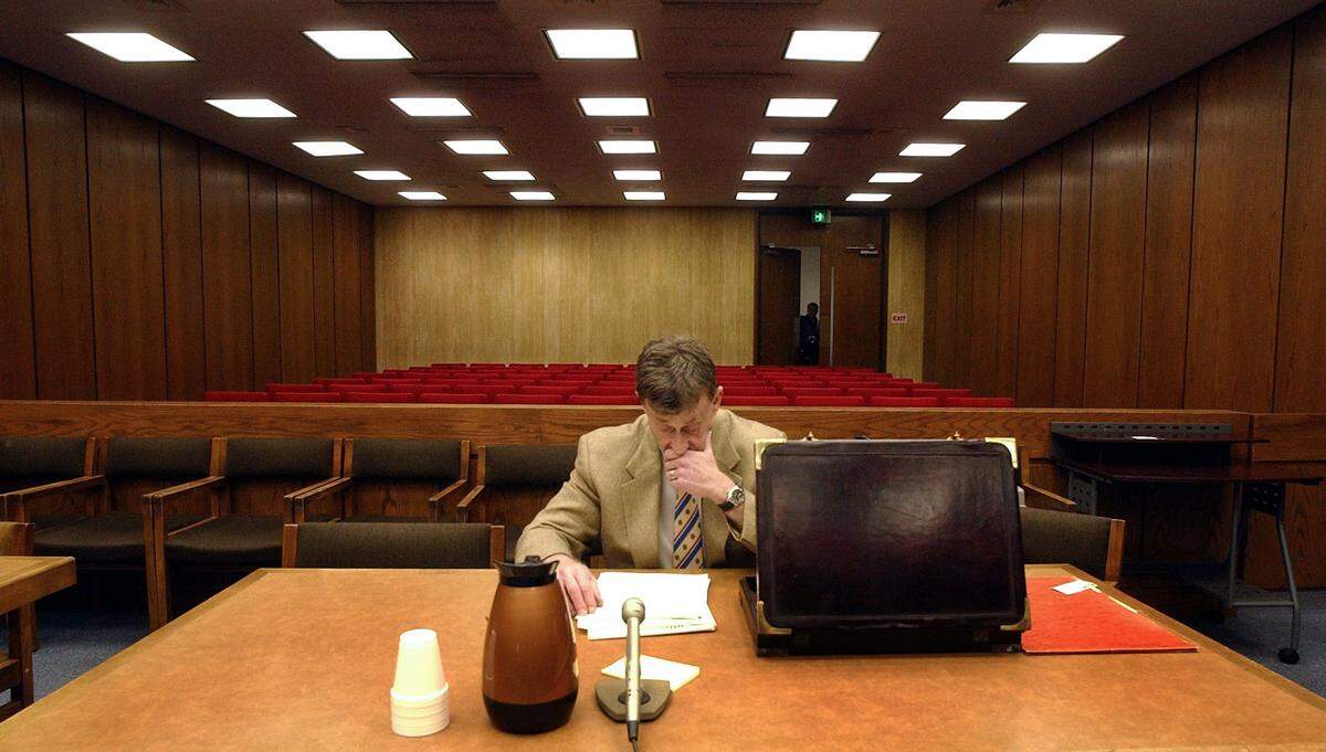 Michael Peterson sits alone in preparation for another day of jury selection in his murder trial at the Durham County Courthouse, May 13, 2003.