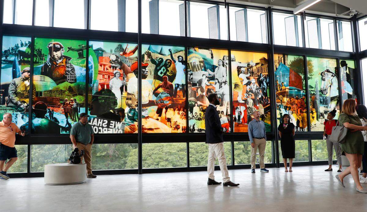 A glass collage welcomes visitors to the second floor of the new community center at John Chavis Memorial Park in Raleigh, N.C., seen Wednesday, June 2, 2021. A grand opening for the 29-acre park with a new two-story community center, plaza, splash pad and playground will be held at 10:30 a.m. June 12.