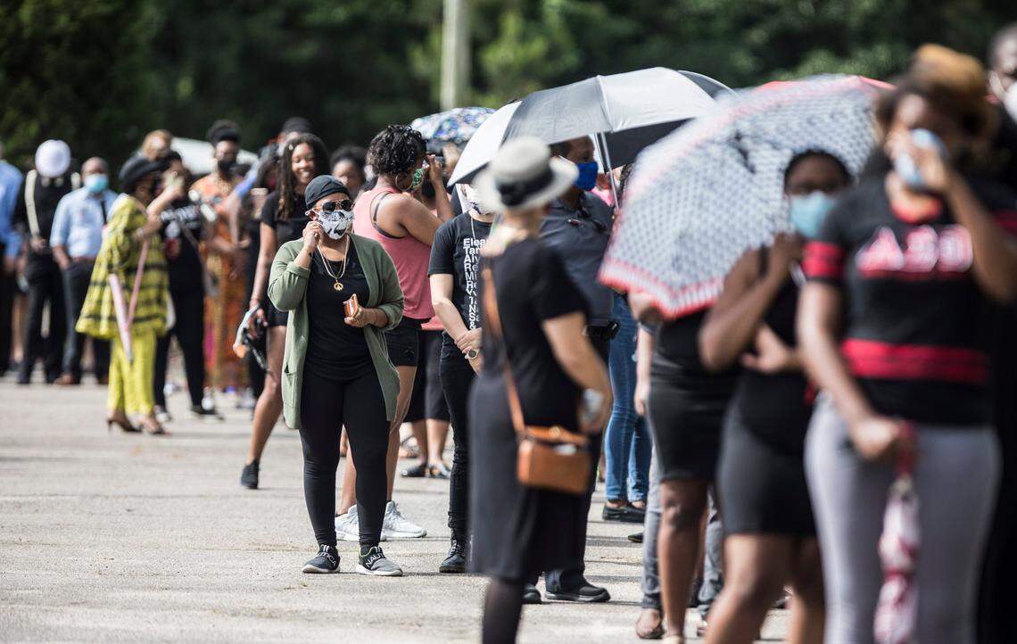 Hundreds of people line up in the parking lot of the R.L. Douglas Cape Fear Conference Center in Raeford, N.C., for a public viewing and a private memorial service on Saturday, June 6, 2020.