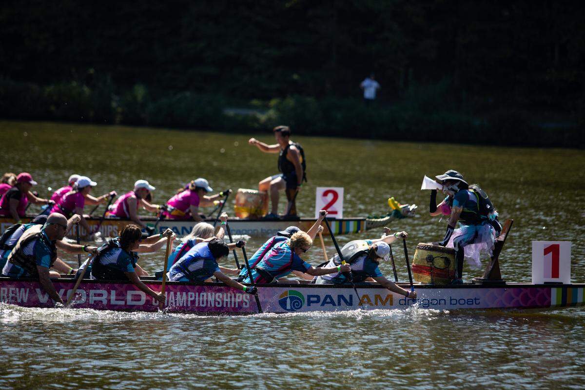 The Chemo-Kazes pull ahead of a competing team during their winning heat at Asia Fest on Sept. 17, 2022, at Booth Amphitheatre in Cary, N.C. The group is made up of survivors of cancer or other illnesses and their caregivers.