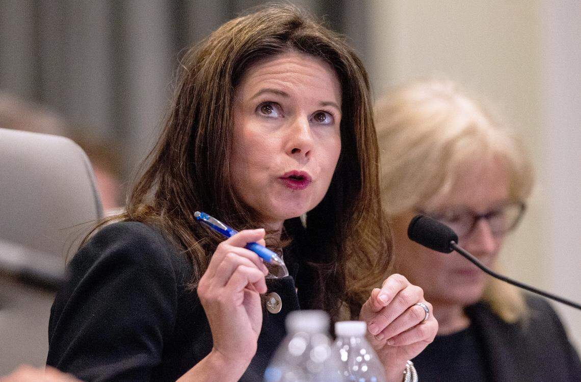 Kim Westbrook Strach, executive director of the Bipartisan State Board of Elections & Ethics Enforcement, left, questions a witness during the second day of a public evidentiary hearing on the 9th Congressional District voting irregularities investigation Tuesday, Feb. 19, 2019, at the North Carolina State Bar in Raleigh.