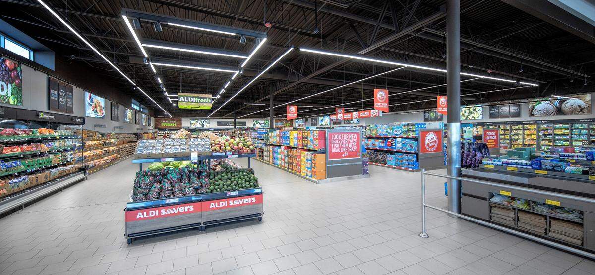Aldi is a no-frills retailer that keeps prices low by charging a fee for paper and plastic bags and requiring customers to bag their own groceries. Customers also “check out” grocery carts using a quarter that they get back when they return the cart to its corral.