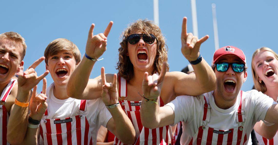 From left N.C. State sophomores Matthew Ramsey, Shane Griffin and Spencer Wright cheer on the Wolfpack before N.C. State’s game against VMI at Carter-Finley Stadium in Raleigh, N.C., Saturday, Sept. 16, 2023.