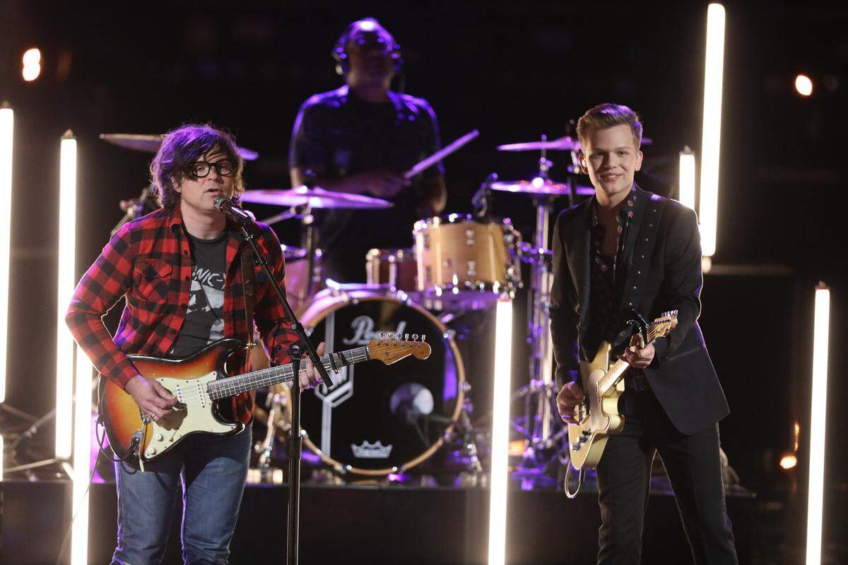 North Carolina native Ryan Adams, left, performs with Britton Buchanan in the finale of "The Voice" on May 22, 2018.