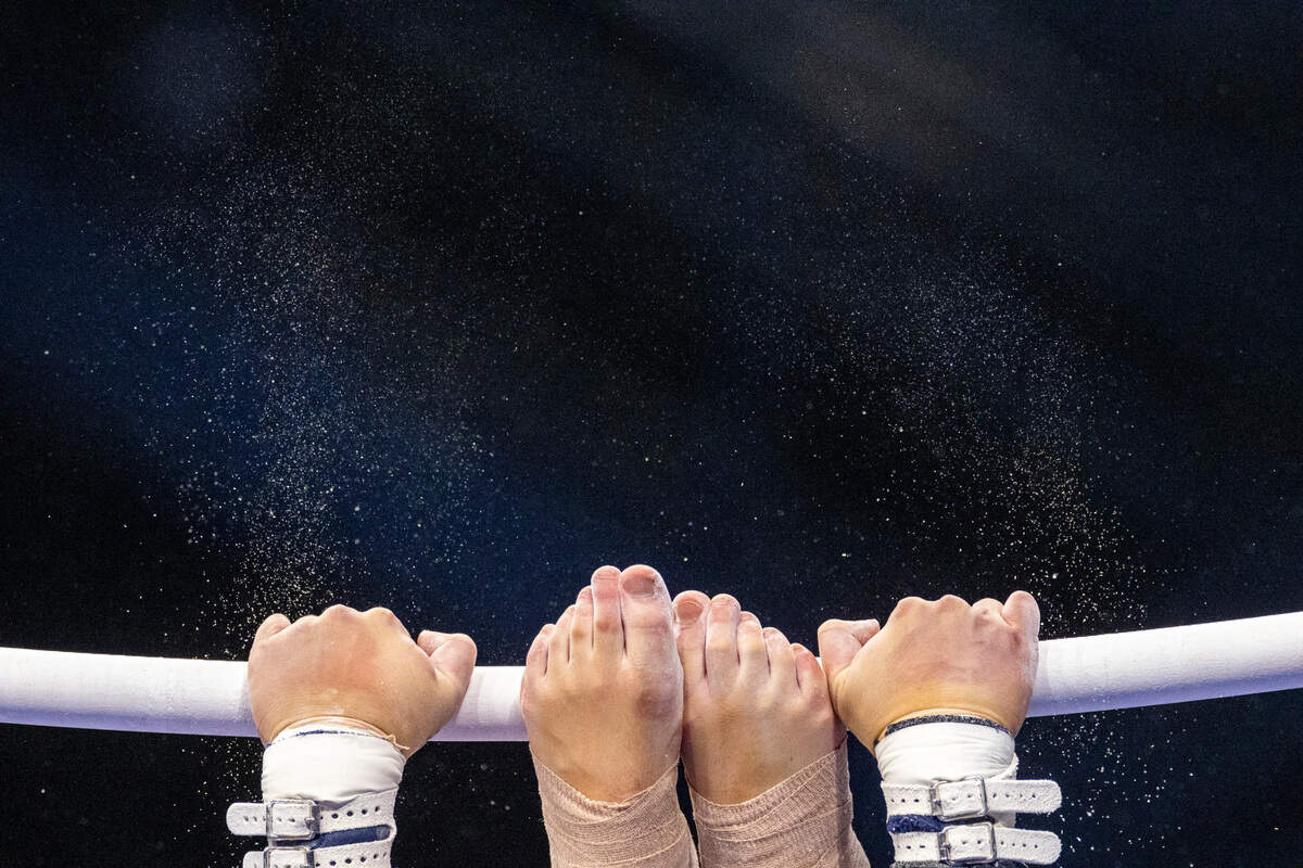 A UNC-Chapel Hill gymnast competes on the uneven bars during a meet against N.C. State on Jan. 19, 2024, in Chapel Hill, N.C. The Wolfpack beat the Tar Heels, 196.225-195.325.