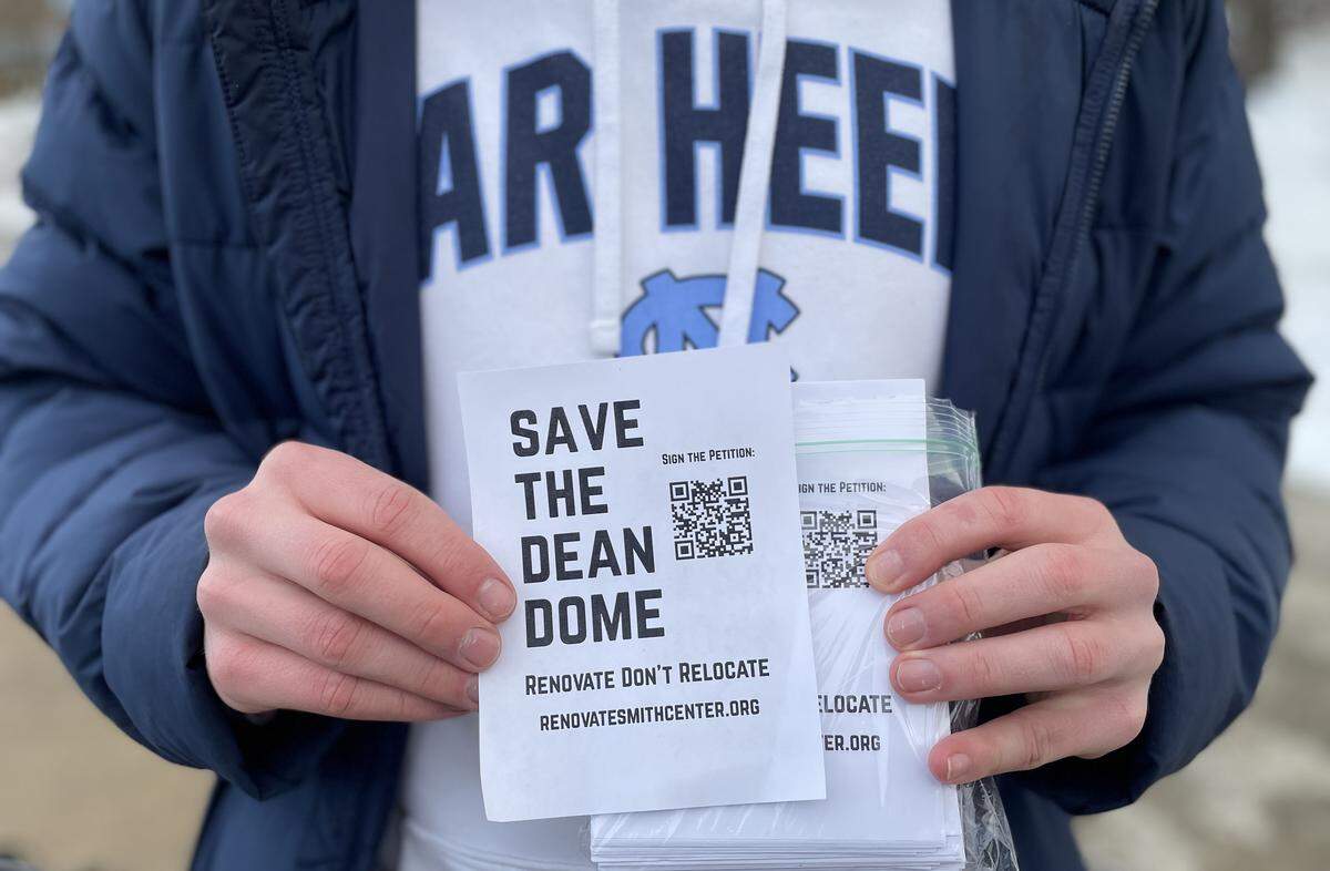 North Carolina students hand out flyers with a petition to renovate and save the Dean E. Smith Center, prior to the Tar Heels’ game against Syracuse on Monday, February 2, 2026 in Chapel Hill, N.C.