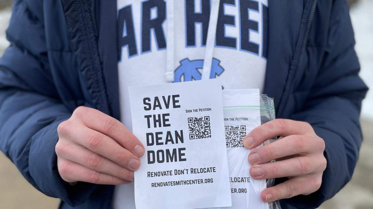 North Carolina students hand out flyers with a petition to renovate and save the Dean E. Smith Center, prior to the Tar Heels’ game against Syracuse on Monday, February 2, 2026 in Chapel Hill, N.C.