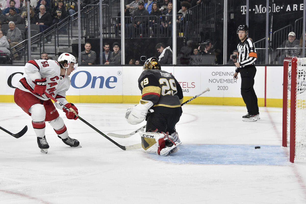 Carolina Hurricanes left wing Erik Haula (56) scores against Vegas Golden Knights goaltender Marc-Andre Fleury (29) during the third period of an NHL hockey game Saturday, Feb. 8, 2020, in Las Vegas. (AP Photo/David Becker)