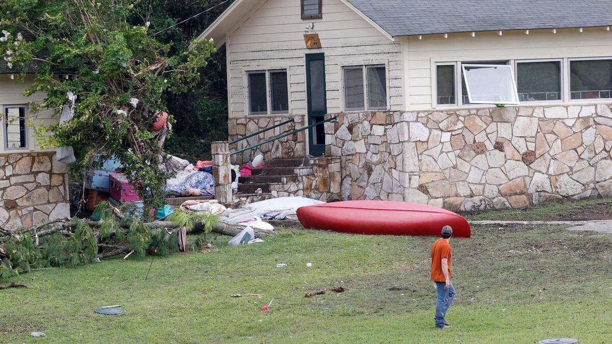 A man walks by a building at Camp Mystic on July 5, 2025, in Hunt, Texas.