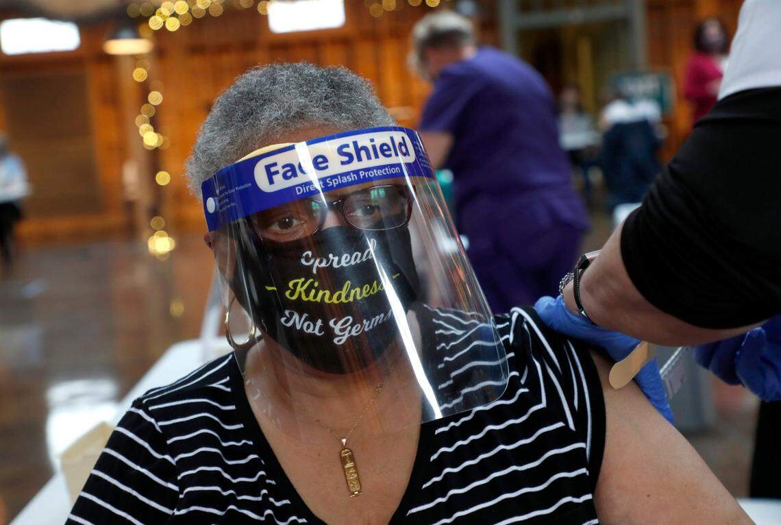 Demetria P. Thomas, 75, of Pinehurst gets her vaccine shot during a COVID-19 vaccination clinic administered by FirstHealth of the Carolinas at the Fair Barn in Pinehurst, N.C., Tuesday, January 26, 2021.