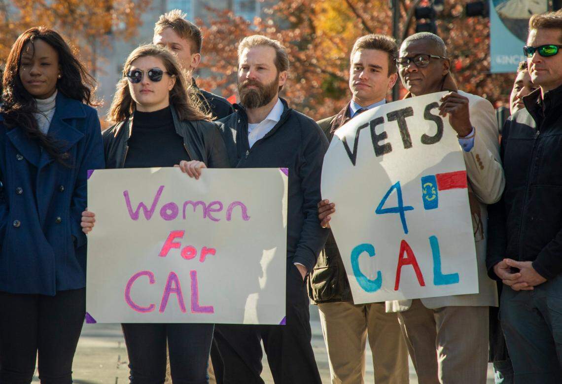 Supporters stand behind former state senator Democrat Cal Cunningham as he formally announces his candidacy filing for the 2020 U.S. Senate race against incumbent Republican Sen. Thom Tillis, on Monday, Dec 2, 2019, in Raleigh, NC.