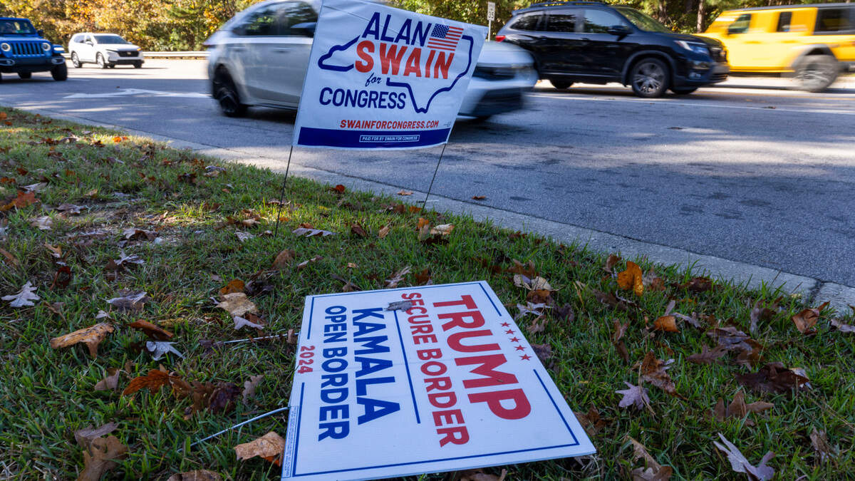 A damaged political sign for the Trump campaign along Maynard Road on Thursday, October 31, 2024 in Cary, N.C.