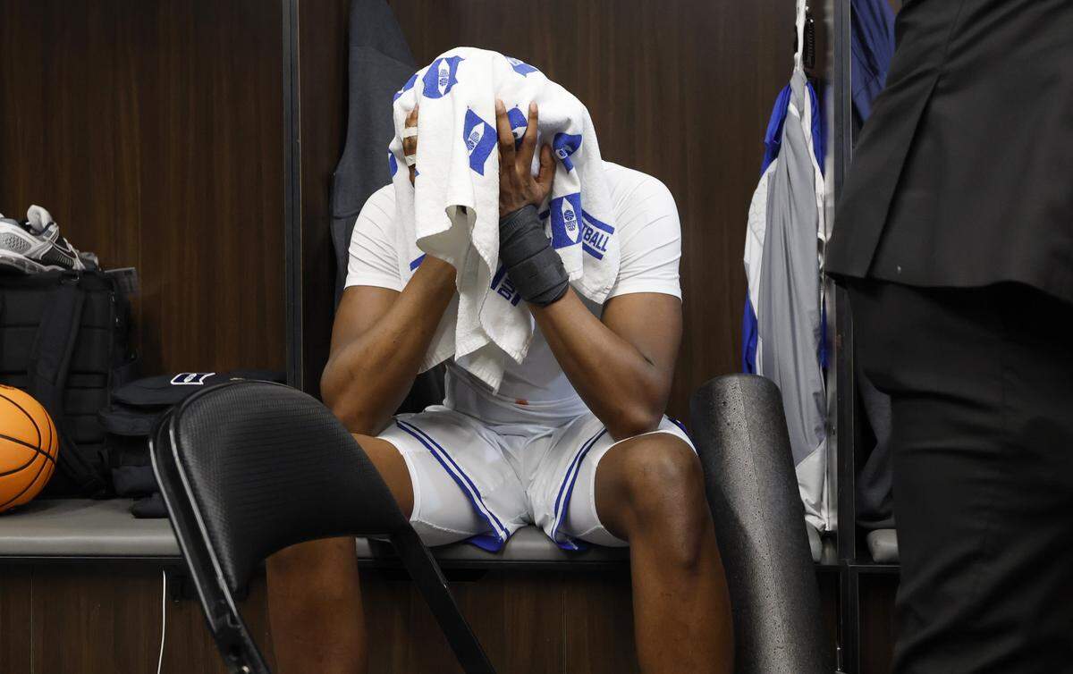Duke’s Patrick Ngongba II sits in the locker room after UConn’s 73-72 victory over Duke in the NCAA Men’s Tournament East Regional Final at Capital One Arena in Washington, D.C., Sunday, March 29, 2026.